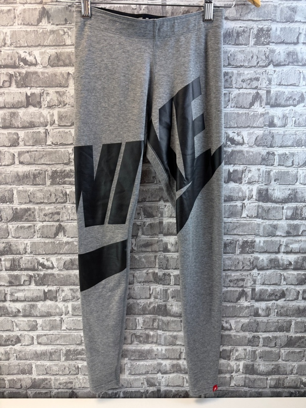 Nike Gray Athletic Leggings with Bold Black Graphic